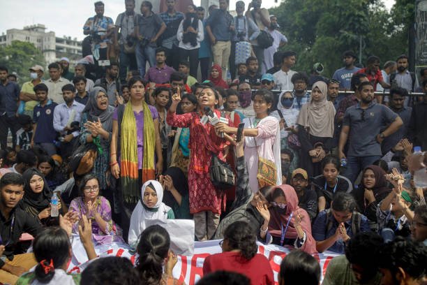 Student activists shout slogans as they protest during a '