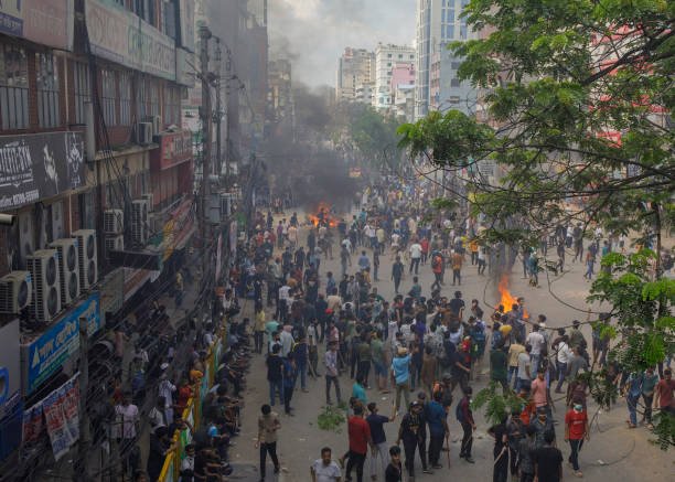 Anti-quota supporters blocked and stand in the road at the