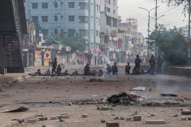 Bangladeshi soldiers take a position at the Mohammadpur area