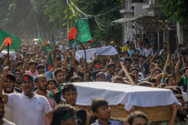 Anti-quota student protesters join in a coffin rally at the