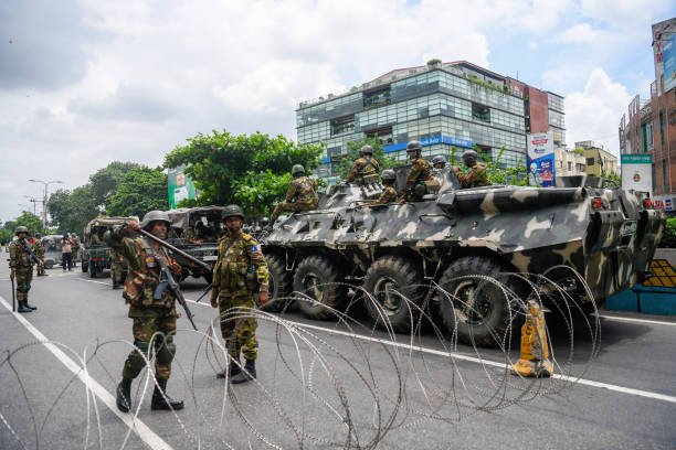 Bangladeshi soldiers are seen installing a barbed wire