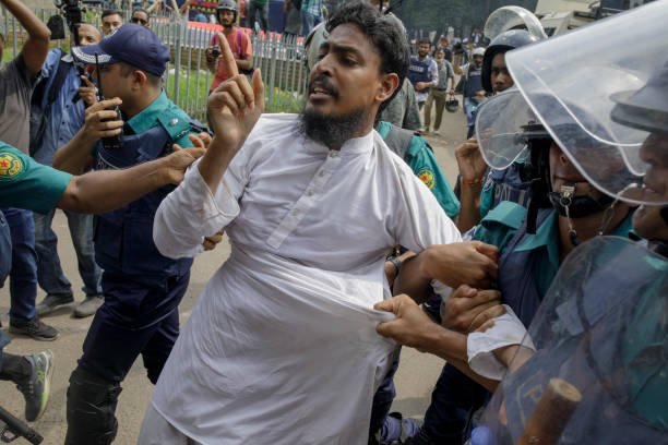 Police detain a man at the University of Dhaka premises, a
