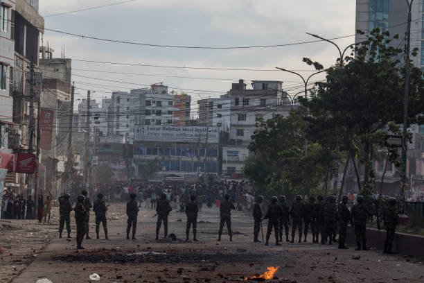 Bangladeshi soldiers take a position at the Mohammadpur area