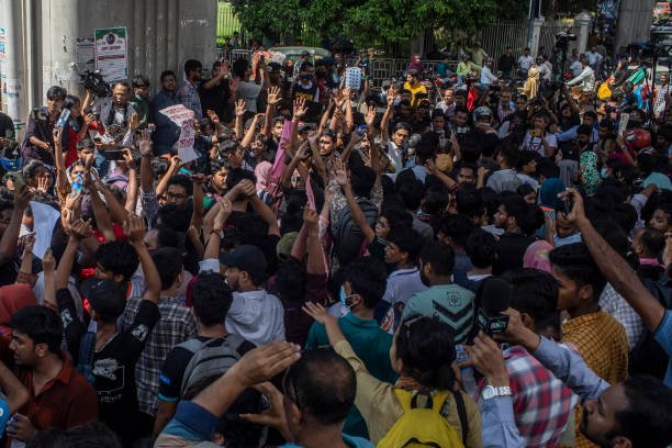 Protesters shout slogans during the demonstration outside