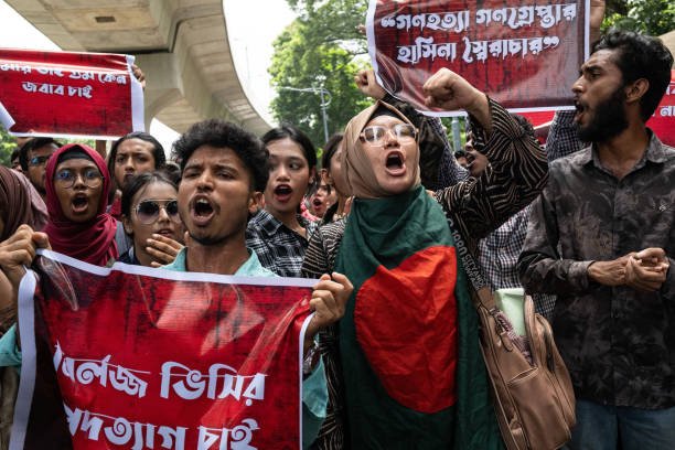Protesters shout slogans during the demonstration outside