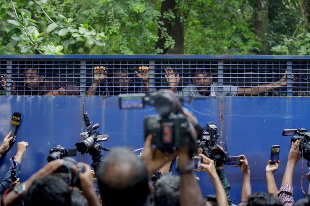 Protesters are being detained as they protest during a '