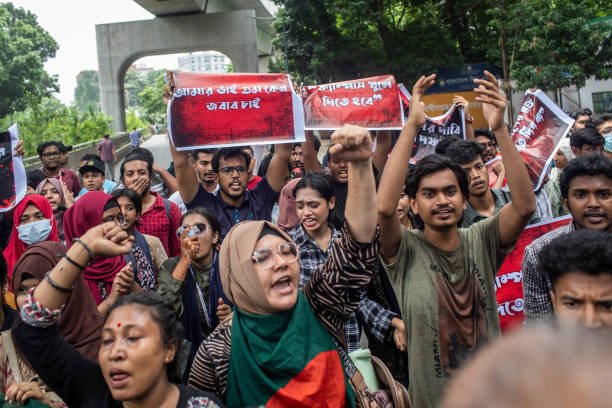 Protesters shout slogans during the demonstration outside