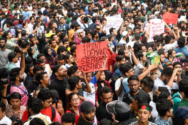 Students hold placards during a protest demanding justice