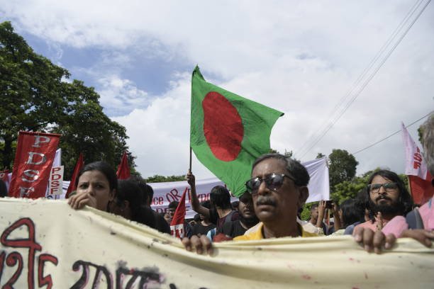 Protesters hold a banner during a solidarity march