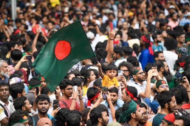 A child holds the Bangladesh National flag during a protest