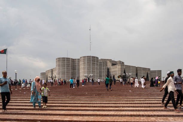 Protesters gather at the parliament house in Dhaka after the