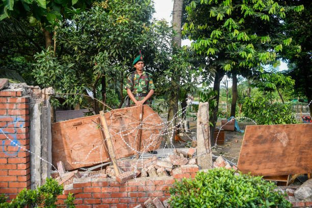 A Bangladeshi Army personnel seen on duty behind a broken
