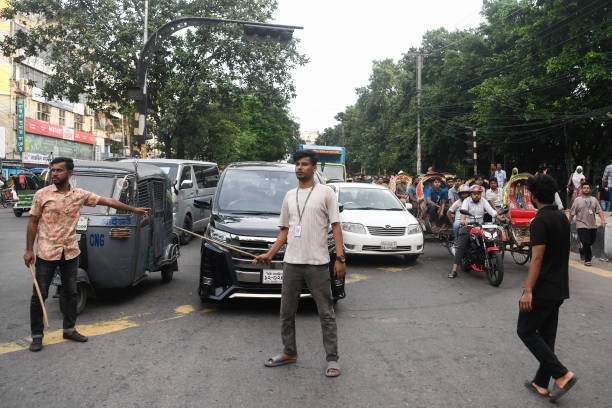 Students take on the responsibility of controlling traffic