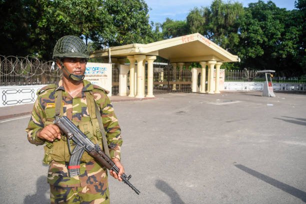 An Army personnel is seen on duty in front of the Bangladesh
